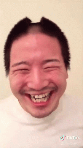 Man With Shaved Head and Beard Smiling TikTok