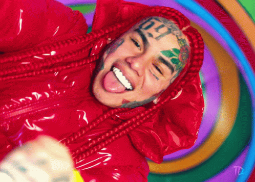Man With Sixty Nine Face Tattoo