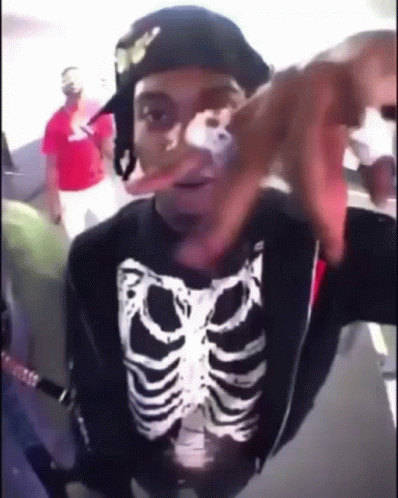 Man with Skeleton Shirt and Hat Funny Face