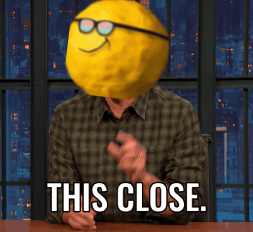 Man With Smiley Face On Head This Close GIF