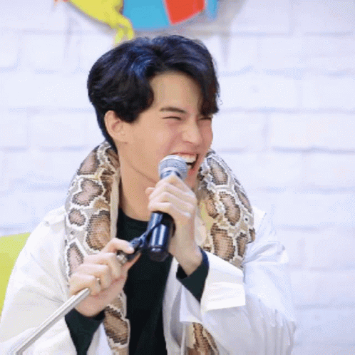 Man With Snake Holding Microphone