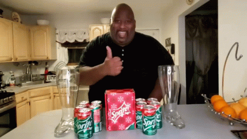 Man With Sprite Cranberry In Cans On Table GIF