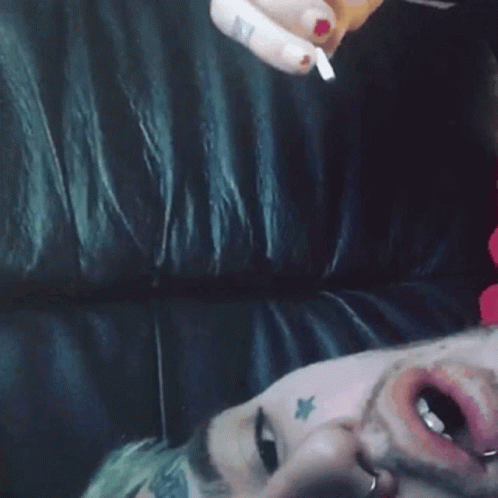 Man With Star Tattoo Lying On Couch GIF