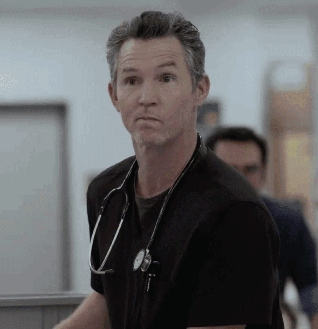 Man With Stethoscope in Black Shirt