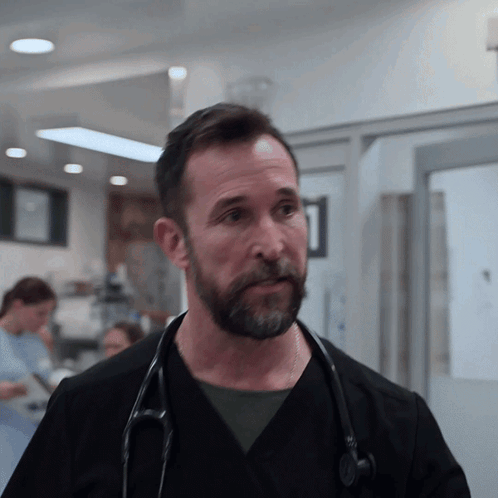 Man With Stethoscope Looking at Camera