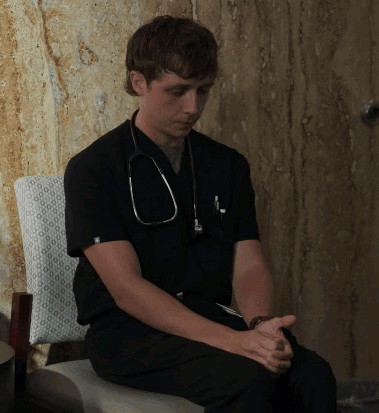 Man With Stethoscope Sitting Hands Folded GIF