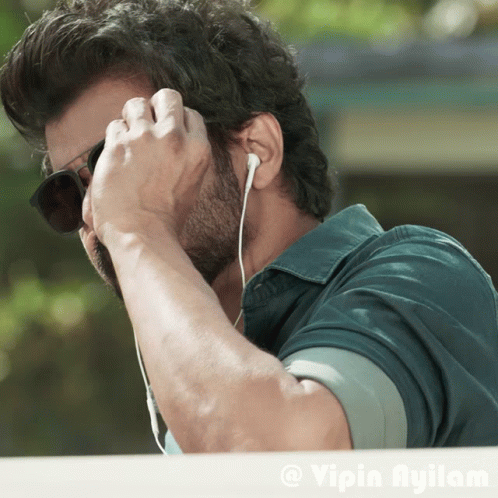Man With Sunglasses and Ear Buds Vipin Ayilam