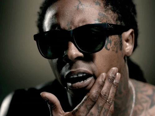 Man with Sunglasses and Face Tattoo