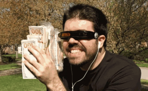 Man With Sunglasses And Headphones Holding $100 Bills GIF