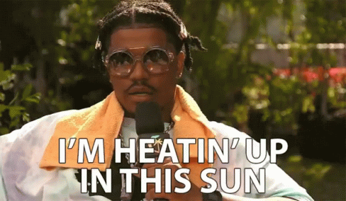 Man With Sunglasses and Towel Saying I'm Heatin Up