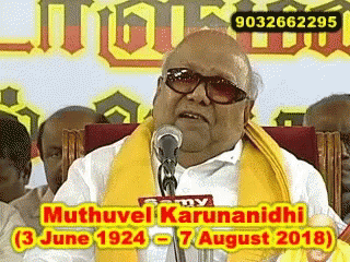 Man With Sunglasses and Yellow Scarf Giving Speech