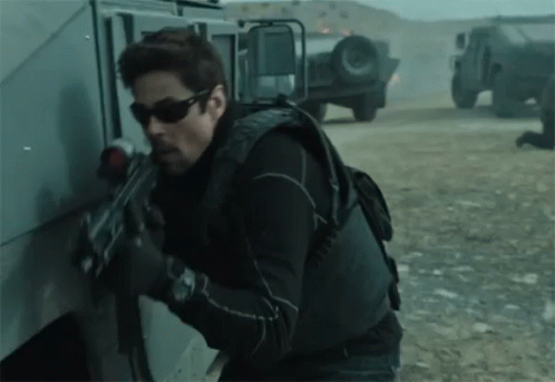 Man With Sunglasses Holding Gun