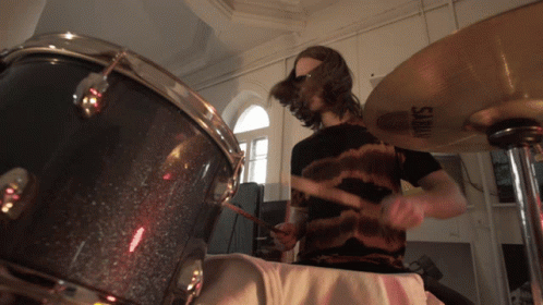 Man With Sunglasses Playing Drum GIF