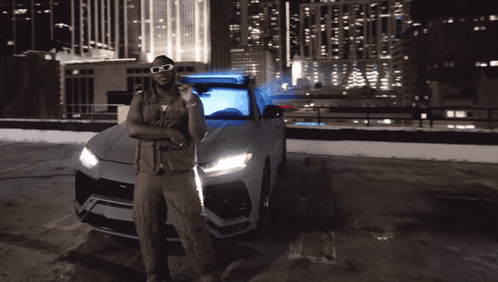 Man With Sunglasses Standing by Car in Parking Lot