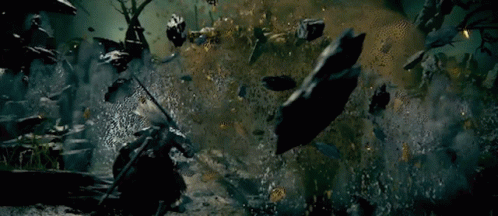 Man with Sword in Cemetery Surrounded by Zombies
