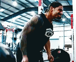 Man With Tattoo Lifts Barbell Row GIF