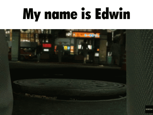 Man With Tattoo Peeking From Manhole Saying My Name Is Edwin GIF