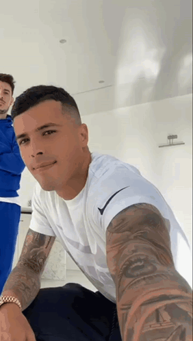 Man With Tattoos Taking Selfie