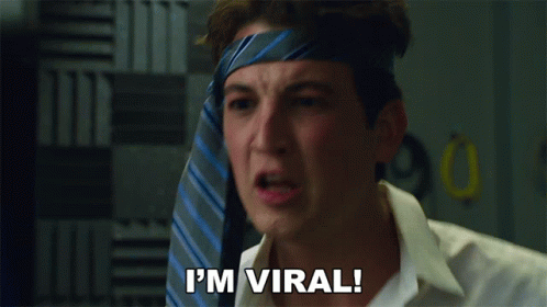 Man With Tie On Head Saying I'm Viral GIF