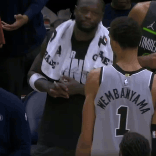 Man with Towel and Number 1 Jersey