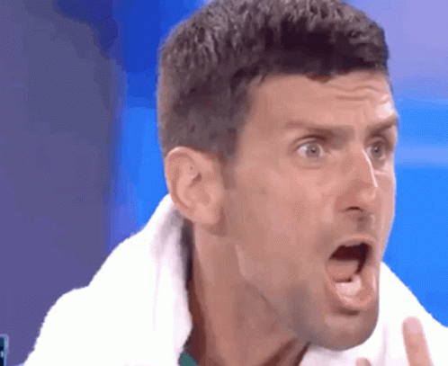 Man With Towel Around Neck Making Funny Face