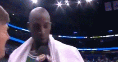 Man With Towel At Microphone In Boxing Ring GIF