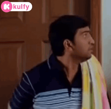 Man With Towel Making Funny Face at Door