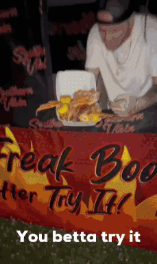 Man With Tray and Freak Boo Better Try It Sign