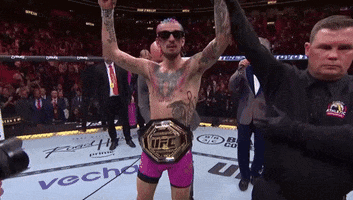 Man With UFC Belt In Wrestling Ring GIF