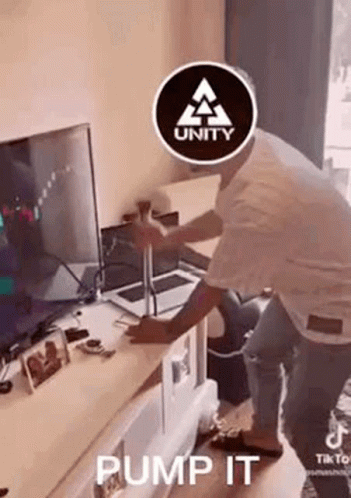 Man With Unity Logo In Front Of Television GIF