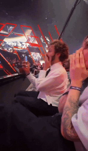 Man With Valorem Wristband Sitting In Stadium GIF
