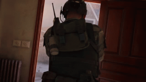 Man With Walkie Talkie Standing in Doorway