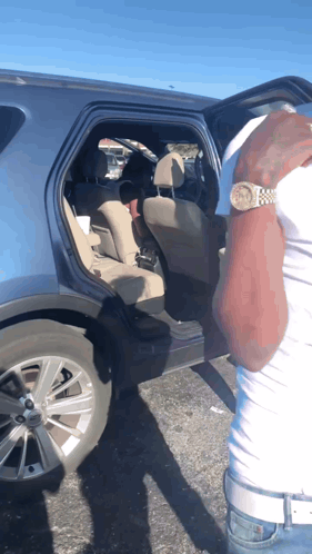 Man With Watch And Car With Open Door GIF