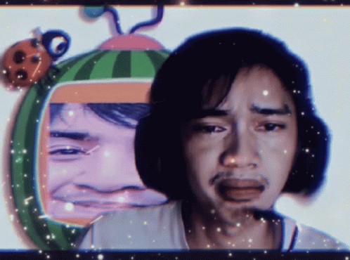 Man With Watermelon On Head Looks Sad GIF