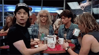 Man With Wayne Reynolds Hat At Table With Others GIF