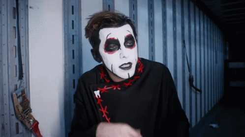 Man with White Face Paint and Black Shirt