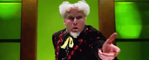Man with White Hair and Beard Pointing