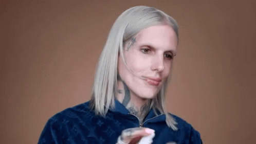 Man With White Hair And Face Tattoo In Blue Jacket GIF