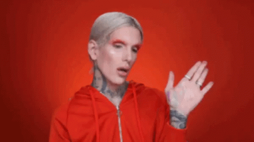 Man With White Hair And Tattoos In Red Hoodie GIF