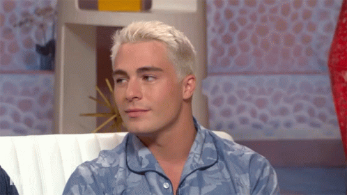 Man With White Hair Sitting on Couch