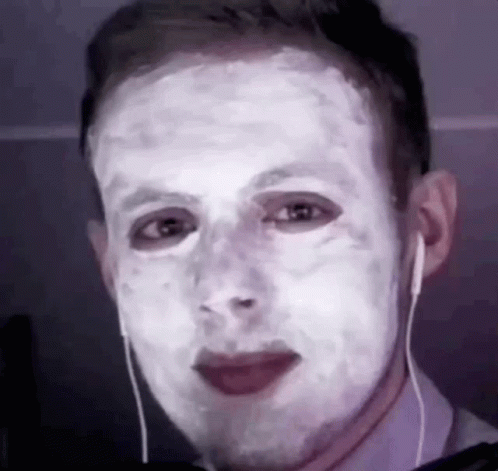 Man With White Mask Wearing Earbuds GIF