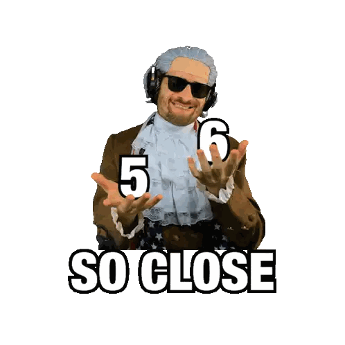 Man with Wig and Sunglasses Holding 5 and 6