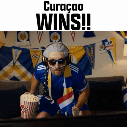 Man With Wig Holding Popcorn Bucket Curaçao Wins