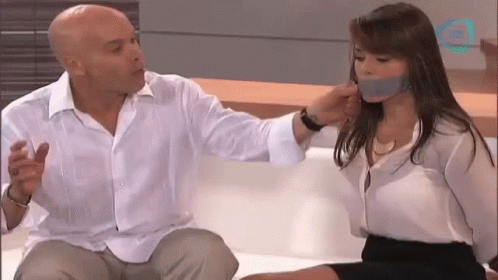 Man With Woman Taped to His Mouth