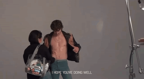 Man Without Shirt Held By Woman Saying I Hope You're Doing Well GIF