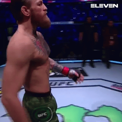 Man Without Shirt Holding Boxing Glove