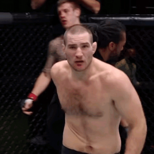 Man Without Shirt in Cage