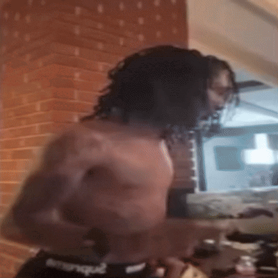 Man Without Shirt In Front Of Brick Wall Kitchen GIF