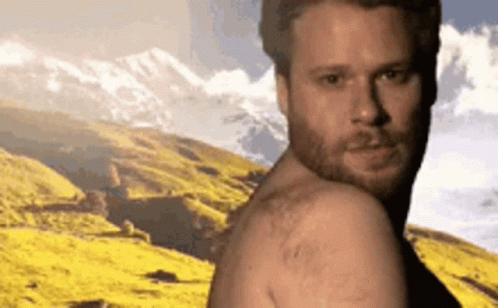Man Without Shirt in Mountain Range