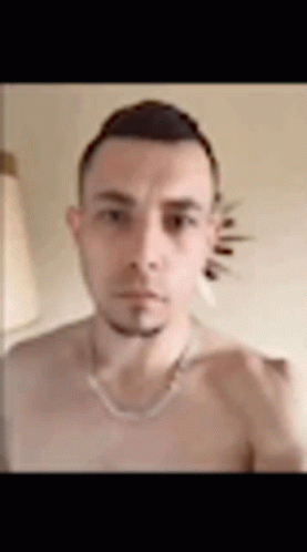 Man Without Shirt Taking Selfie With Necklace